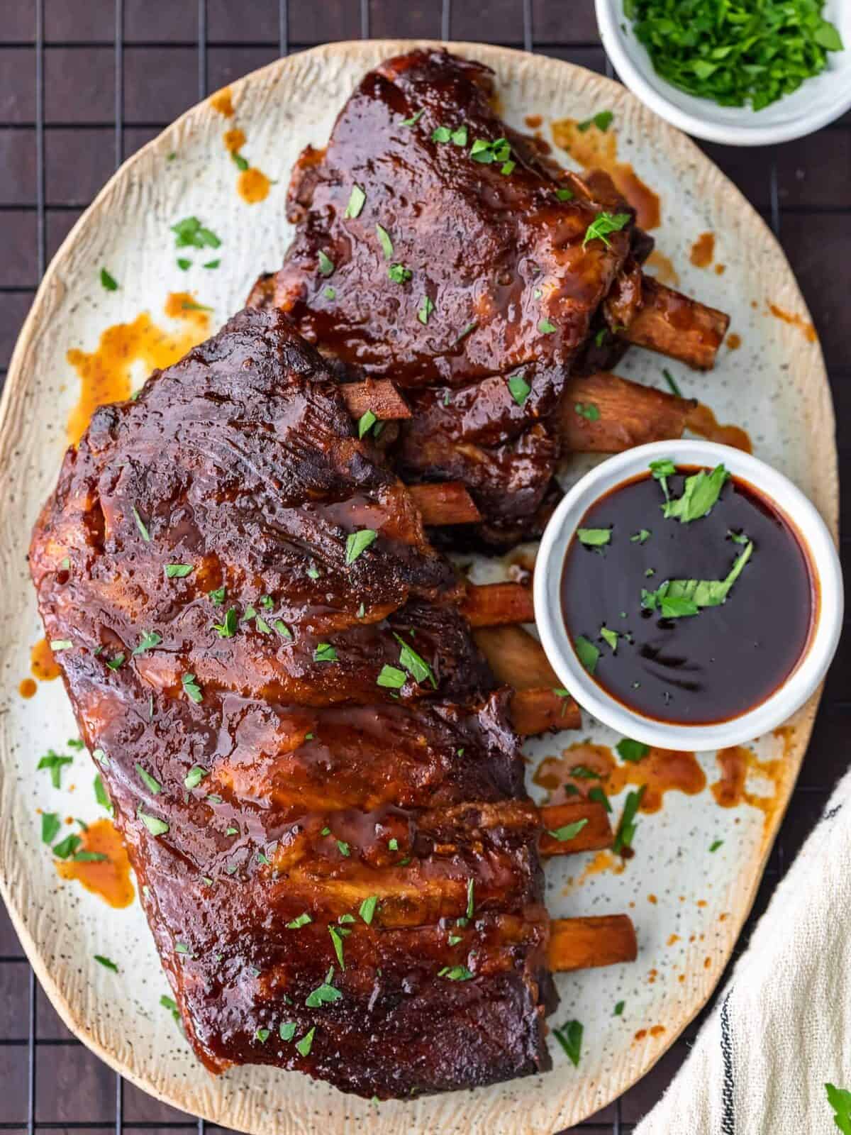 Crock Pot Ribs are an easy way to make the most delicious ribs for any occasion. This slow cooker ribs recipe is so simple! You can cook these crock pot BBQ ribs stress-free, and they'll come out super tender and flavorful. crock pot ribs