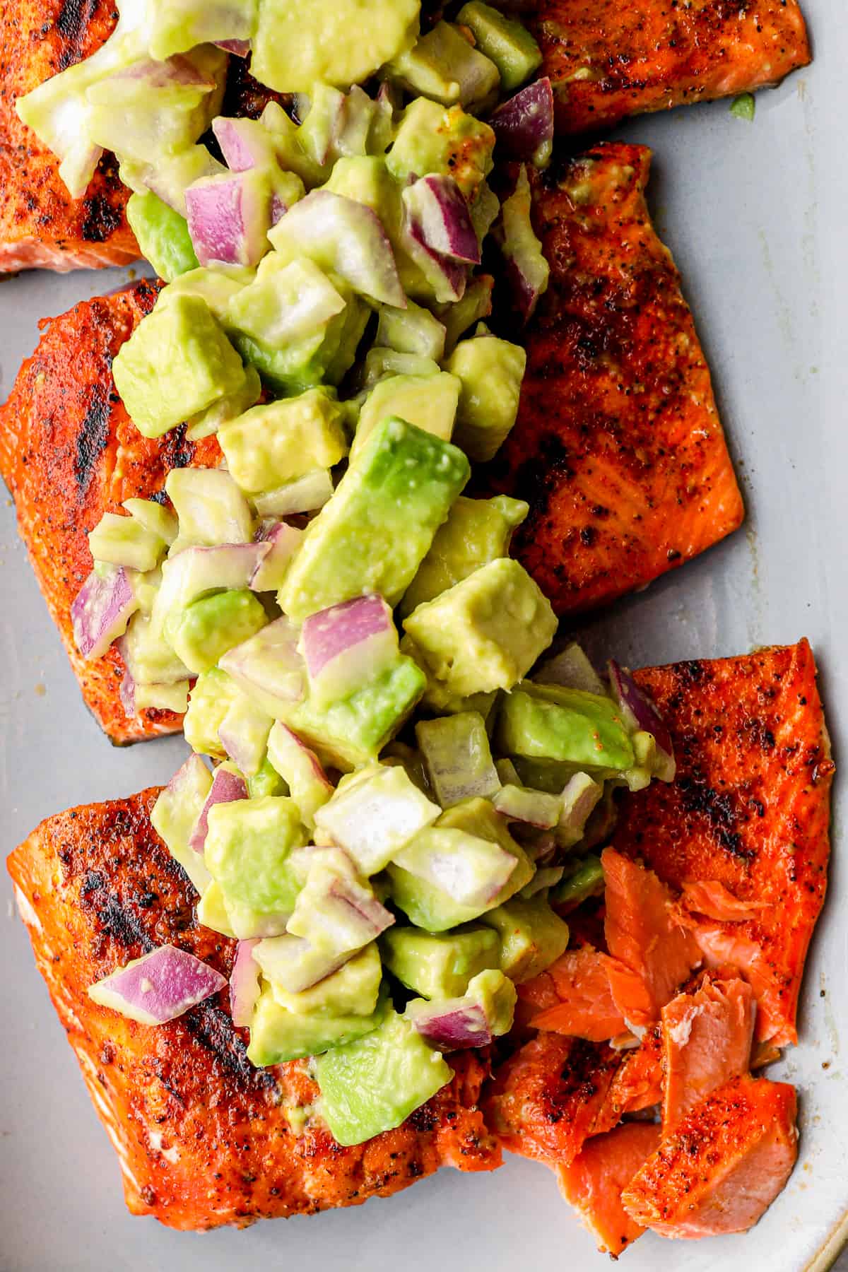 Grilled Salmon Recipe with Avocado Salsa (Healthy Whole30 Salmon Recipe!) is the BEST Salmon Recipe and just happens to be Whole30 approved! platter of grilled salmon with avocado salsa