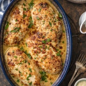 This Caesar Chicken Recipe (MELT IN YOUR MOUTH and only 4 Ingredients!) is made with only 3 ingredients (say WHAT?!) and is oh so tender and delicious. Easiest tastiest weeknight dinner ever. Made with just chicken, sour cream, creamy caesar, and grated parmesan. It will knock your socks off for both its flavor and how easy it is!