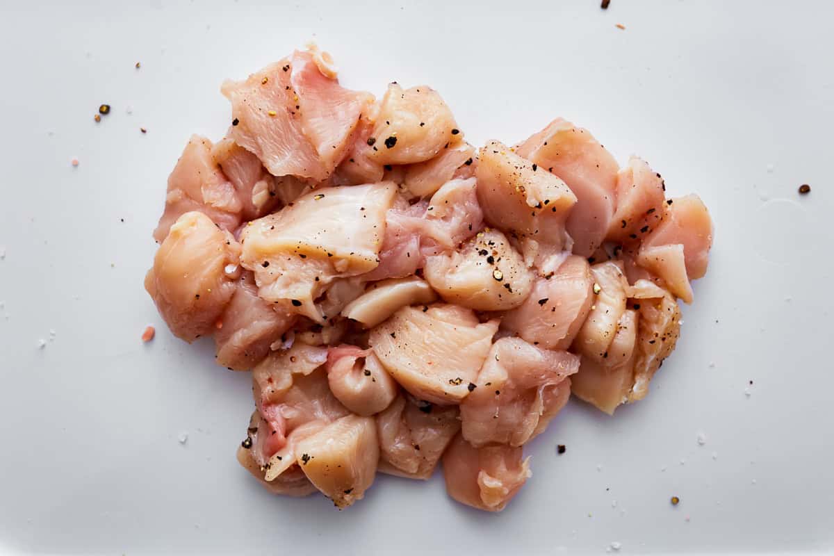 seasoned cubed raw chicken.